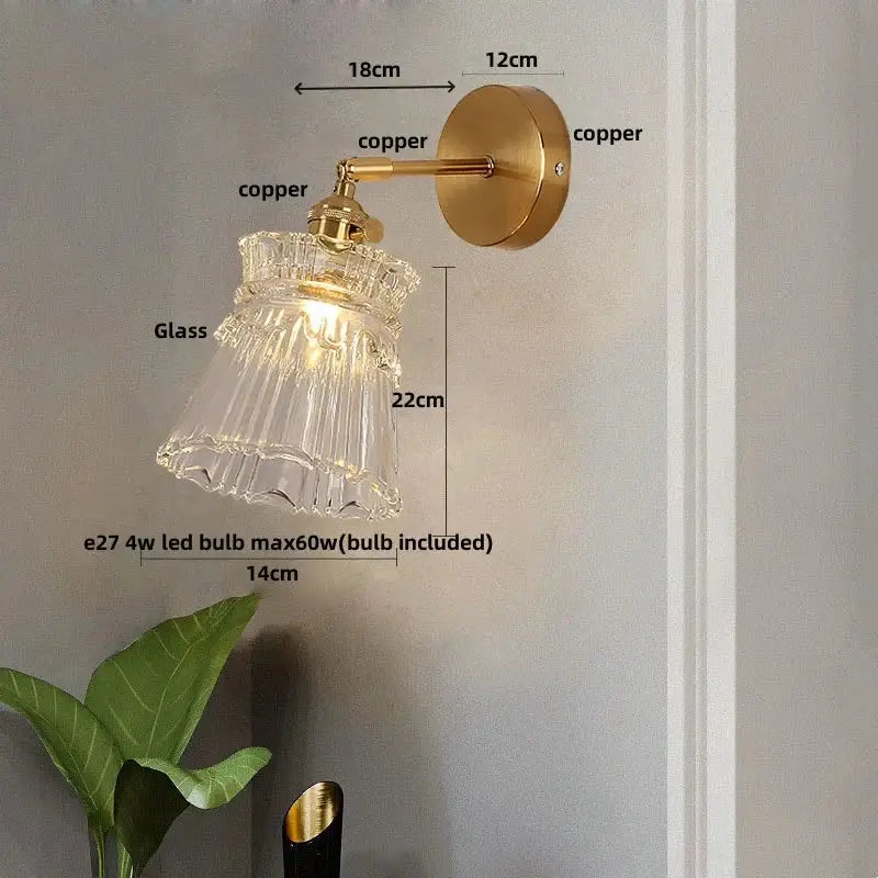 Modern gold wall lamp with clear glass shade brass-finished arm and pull chain for bedroom decorbites clear glass