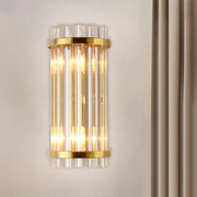 Modern gold wall lamp with crystal rod shade featuring vertical clear glass rods for elegant bedroom sconce lighting