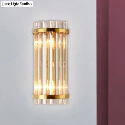 Modern gold wall lamp with crystal rod shade featuring vertical clear glass tubes for bedroom use
