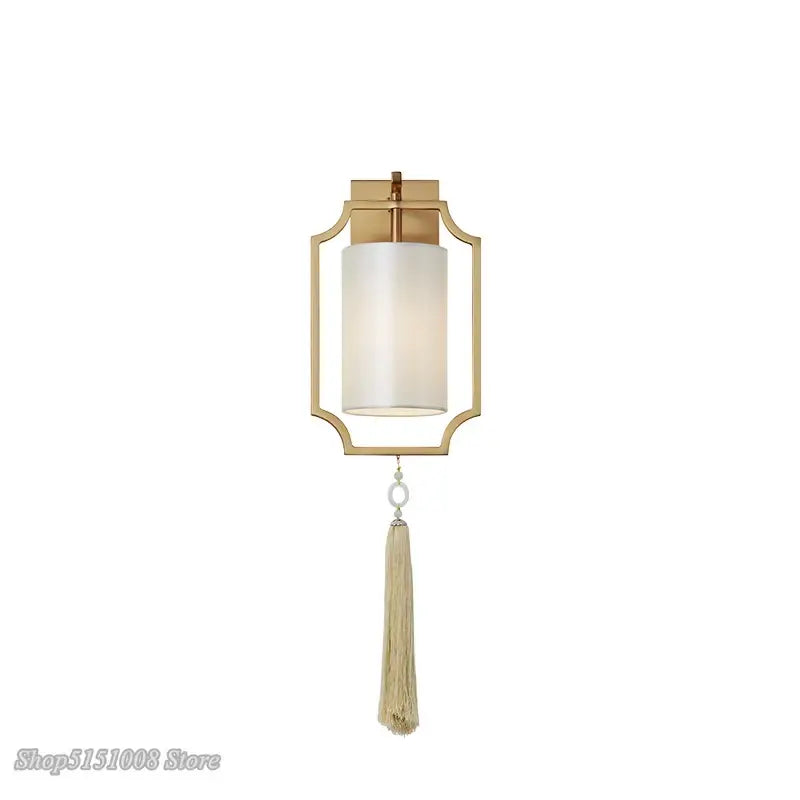 Modern gold wall lights with a frosted glass cylinder shade and beige tassel for stylish living room decorbites copper wall lights