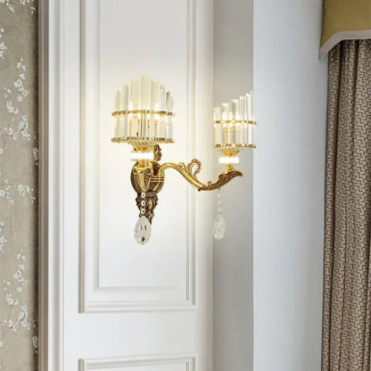 Modern gold wall mount light arc sconce with ornate gold tone and crystal accents for bedroom use