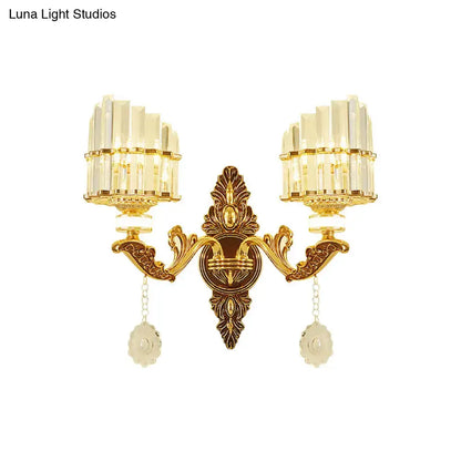 Modern gold wall mount light arc sconce with two crystal-encrusted fixtures and decorative pendants for bedroom use