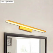Modern gold wall mounted led vanity light with aluminum slim rectangular design providing warm white light above mirror