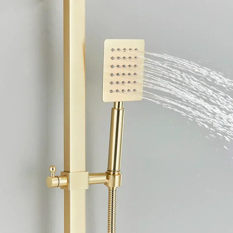 Modern gold wall mounted rain shower system kit featuring a gold-finished square showerhead with perforated face