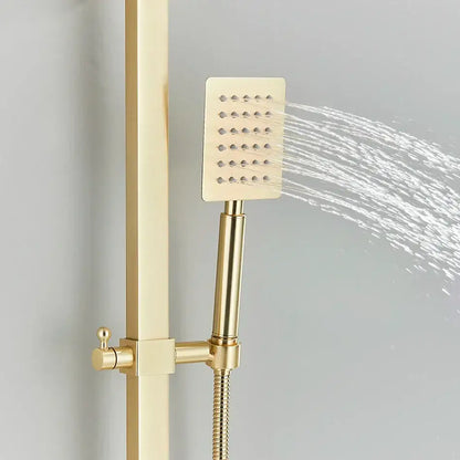 Modern gold wall mounted rain shower system kit featuring a gold-finished square showerhead with perforated face