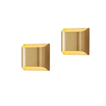 Modern gold wall sconce with sleek angular design and curved edges copper brass wall lamp for minimalist decorbites decor