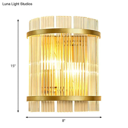 Modern gold wall sconce with clear crystal vertical rods and horizontal metal bands for elegant hallway lighting