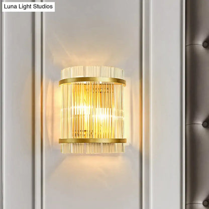 Modern gold wall sconce featuring clear crystal rods designed for elegant hallway lighting