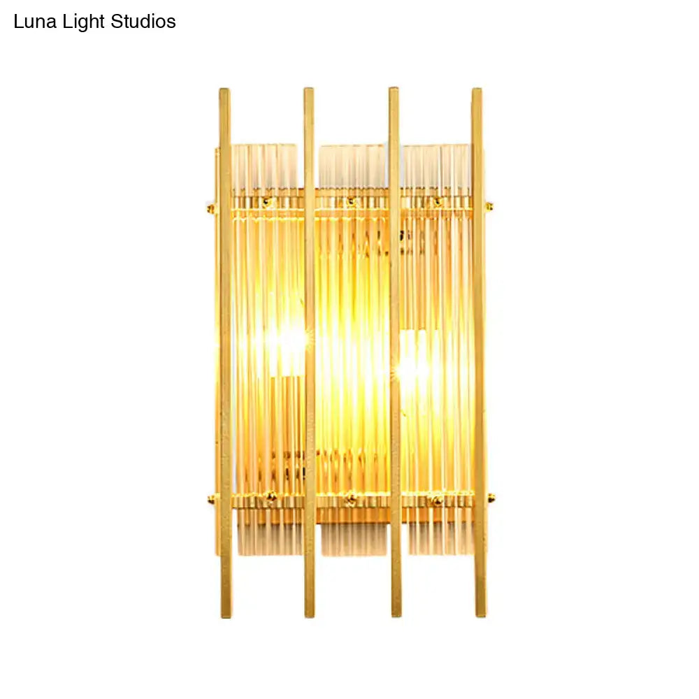 Modern gold wall sconce with clear crystal rods and warm glowing light for elegant hallway lighting