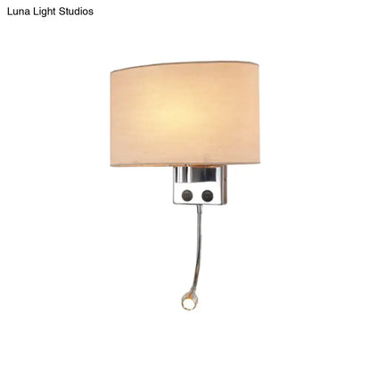Modern gold wall sconce with cream fabric shade and chrome adjustable reading light approximately 12 inches tall