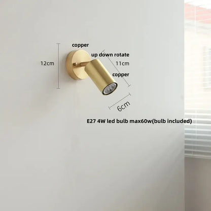 Modern gold walnut wall sconce with copper finish and adjustable spotlight featuring a pull chain switch for bedroom use