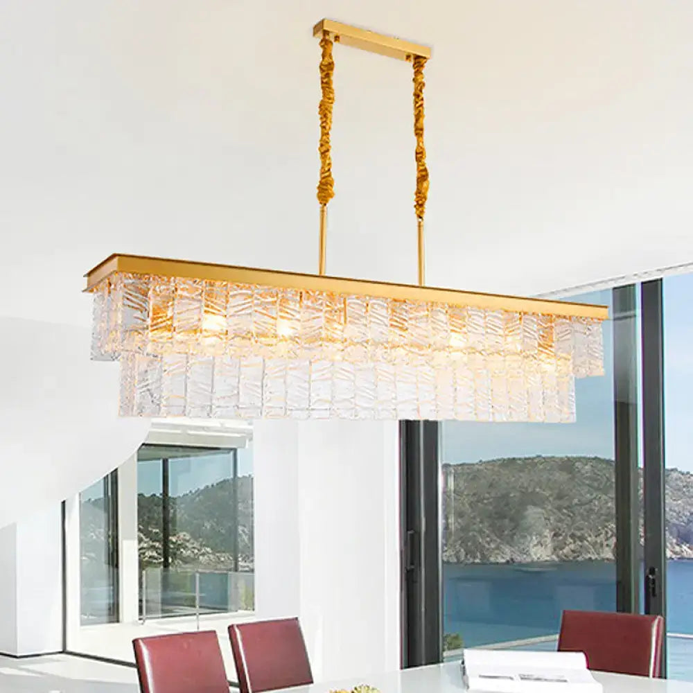 Modern gold water crystal pendant light with textured crystal panels and twisted brass chains for ceiling light use
