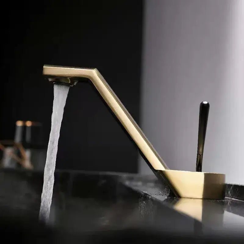 Modern gold waterfall decorbites black basin faucet with sleek angular design and flowing water stream for bathroom use