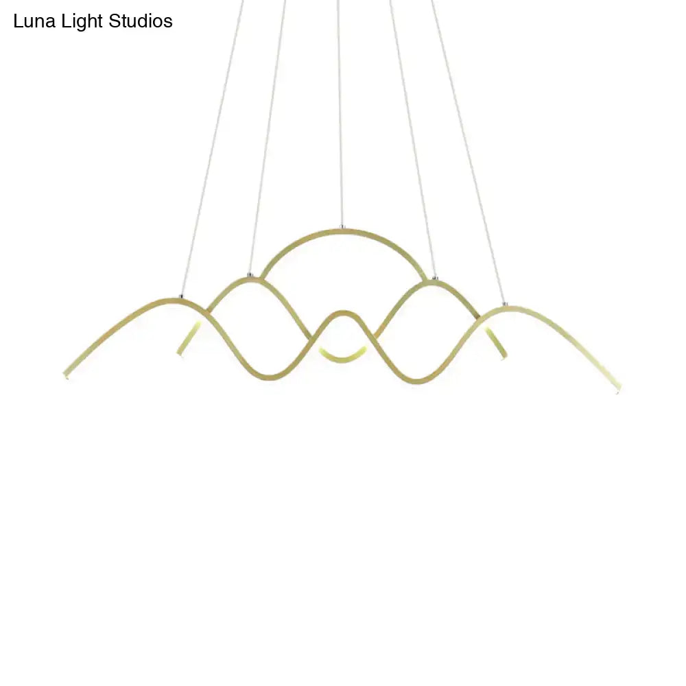 Modern gold-toned led chandelier by DecorBites with a sleek wave-like design and warm white light suspended by cords