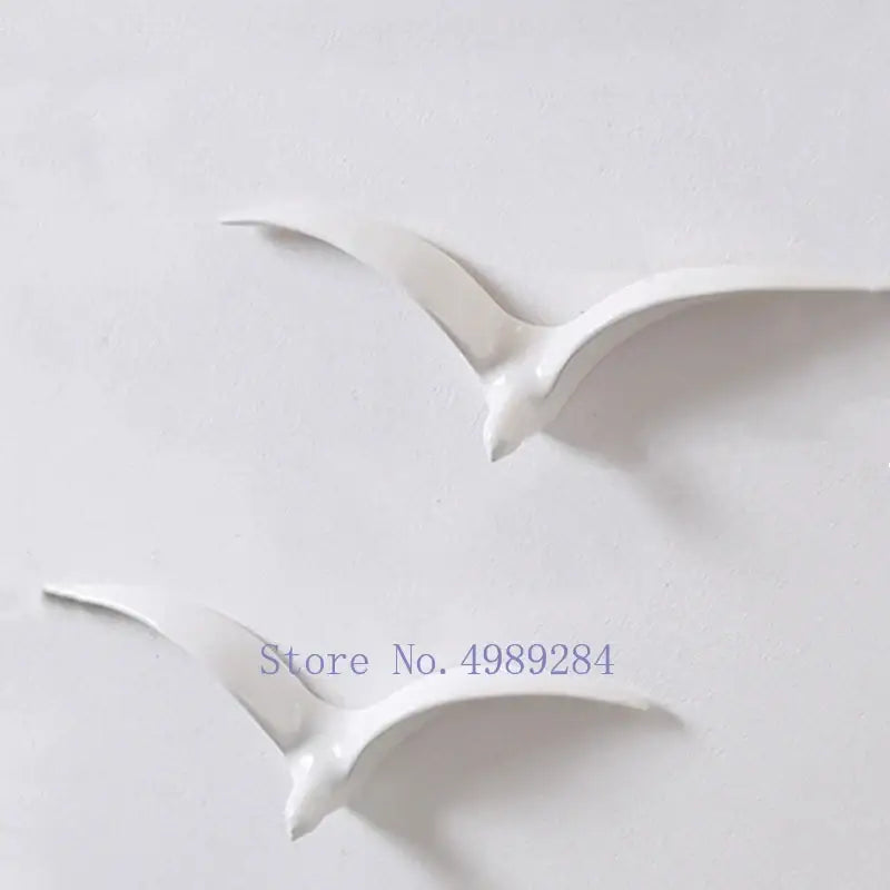 Two white ceramic seagull pieces in modern gold and white ceramic pendant wall decor for living room wall decor