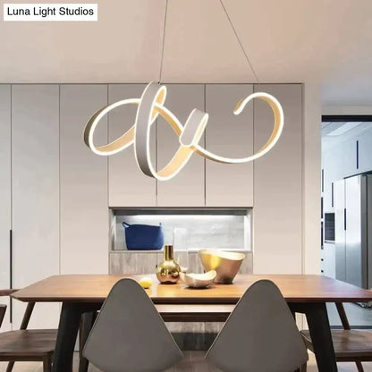 Modern gold and white led pendant lights featuring intertwined rings suspended for dining room lighting