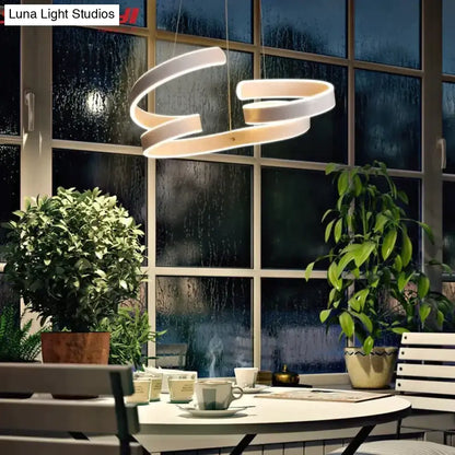 Modern gold and white led pendant lights featuring a sleek spiral design ideal for dining room pendant lights