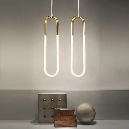 Two modern pendant lights with gold metal frames and white LED tubes for living room decorbites gold pendant lighting