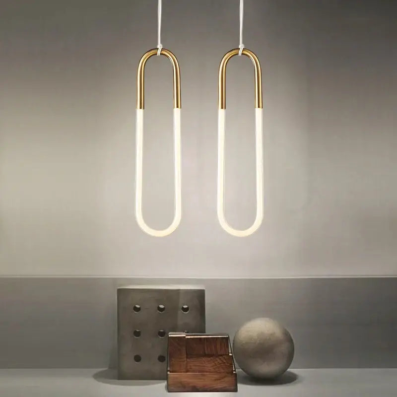 Two modern pendant lights with gold metal frames and white LED tubes for living room decorbites gold pendant lighting