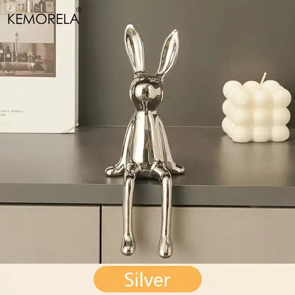 Silver metallic sitting rabbit ornament with sleek minimalist design for modern living room decor