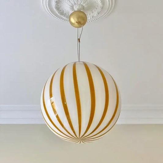 Modern gold and white striped glass ball pendant light featuring vertical stripes for kitchen ceiling lighting