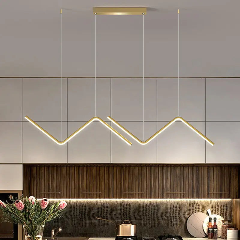 Modern gold zigzag pendant lighting fixture with sleek design and minimalist aesthetic for dining room use