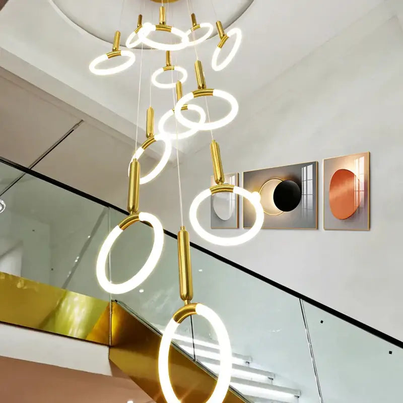 Modern golden acrylic round led chandelier with gold-toned circular illuminated rings for living room decorbites golden acrylic