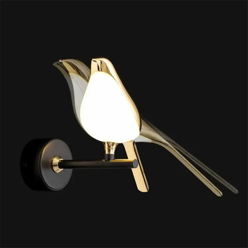 Modern golden bird led wall lamp with sleek metallic finish and glowing white diffuser for bedroom decorbites golden bird sconce