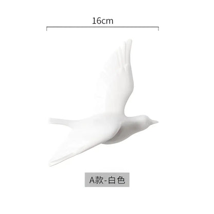 White ceramic bird figurine 16cm length featured in modern golden bird wall hanging for living room decor