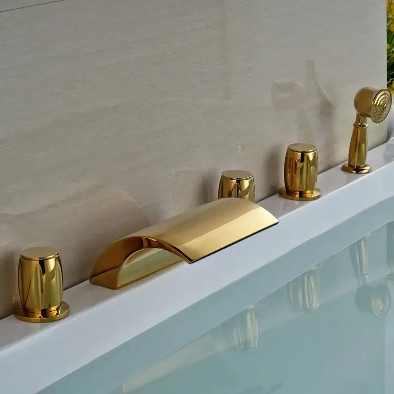 Modern golden brass bathtub faucet with curved spout and three cylindrical handles decorbites golden brass fixture