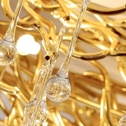 Modern decorbites golden chandelier with intricate teardrop-shaped crystal pendant lights for dining room decor
