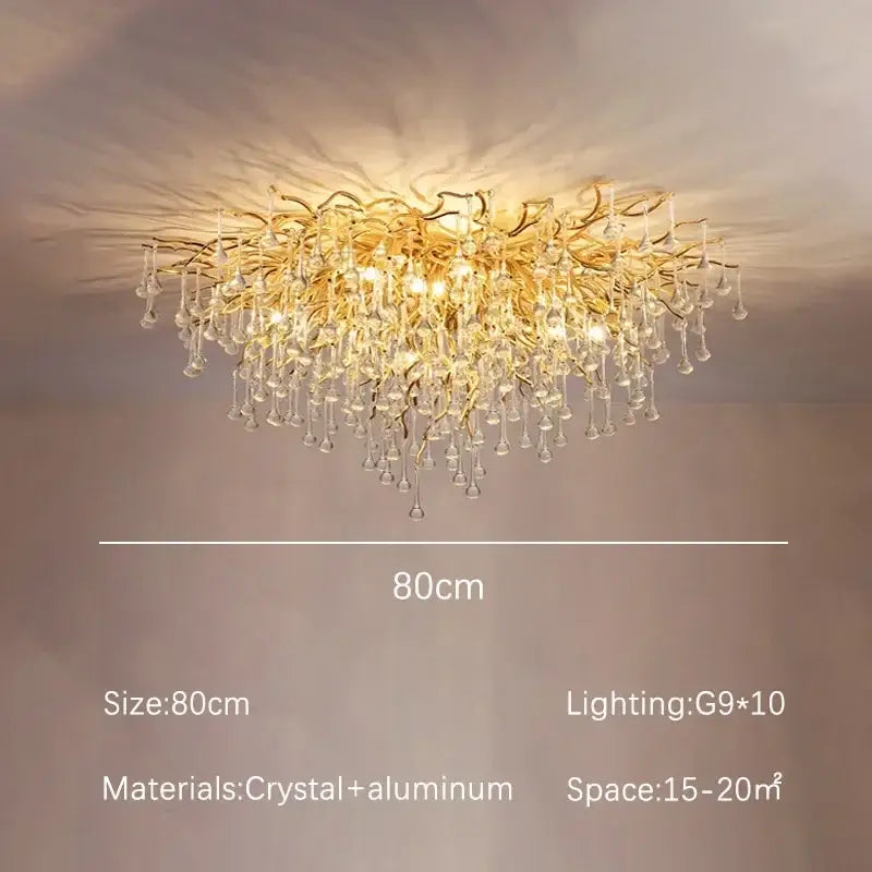 Modern decorbites golden chandelier with branching aluminum arms and dangling teardrop crystals for dining room decor