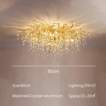Modern decorbites golden chandelier with branching aluminum arms and dangling teardrop crystals for dining room decor