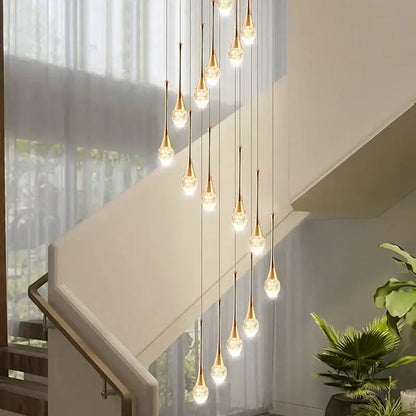 Modern golden crystal led staircase chandelier with teardrop glass shades in a cascading decorbites crystal led design