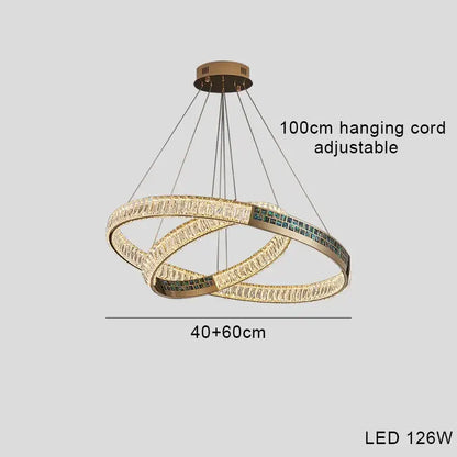 Modern golden crystal ring ceiling chandelier with gold-toned led interlocking rings and clear green crystal accents