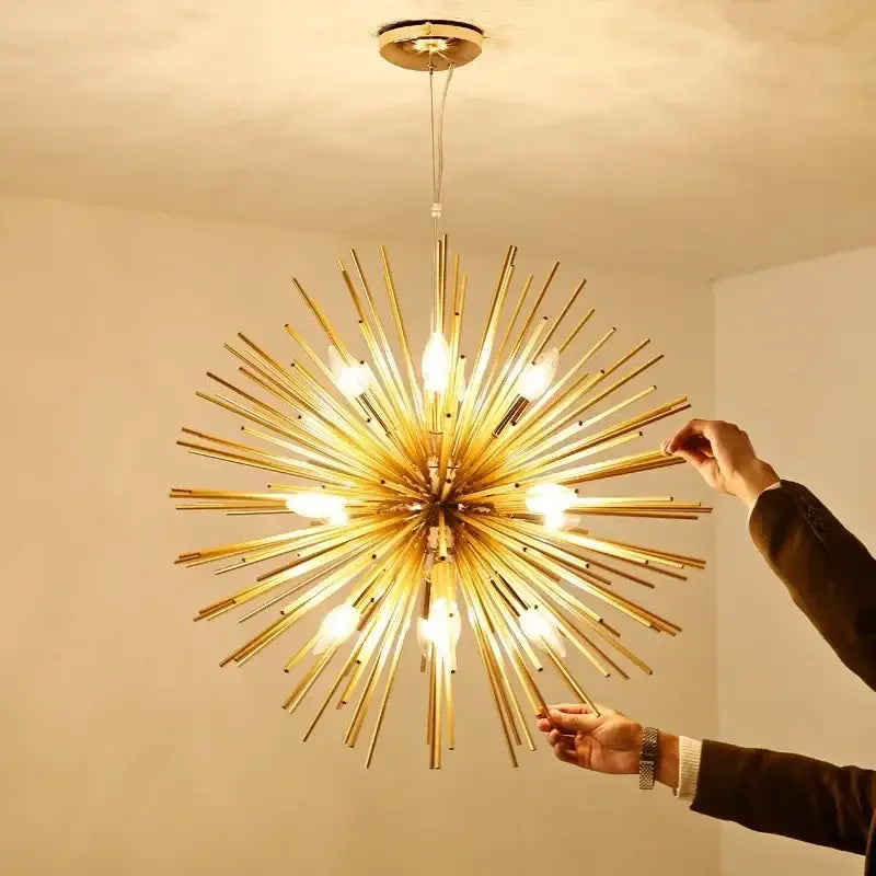 Modern golden decorbites geometric starburst chandelier with exposed bulbs radiating from a central hub for dining rooms