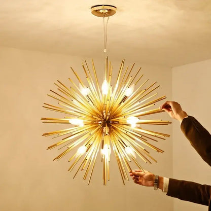 Modern golden decorbites geometric starburst chandelier with exposed bulbs radiating from a central hub for dining rooms