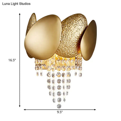 Modern golden egg wall mount light featuring textured metallic plates and clear crystal droplets for elegant bedroom decor