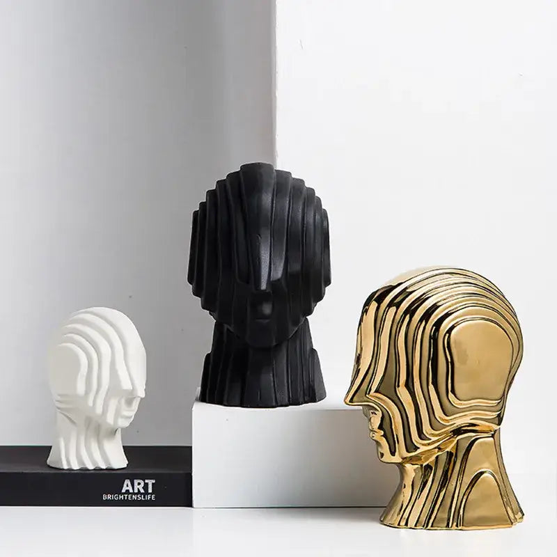 Three abstract geometric ceramic head sculptures in white black and gold for modern living room decorbites decor