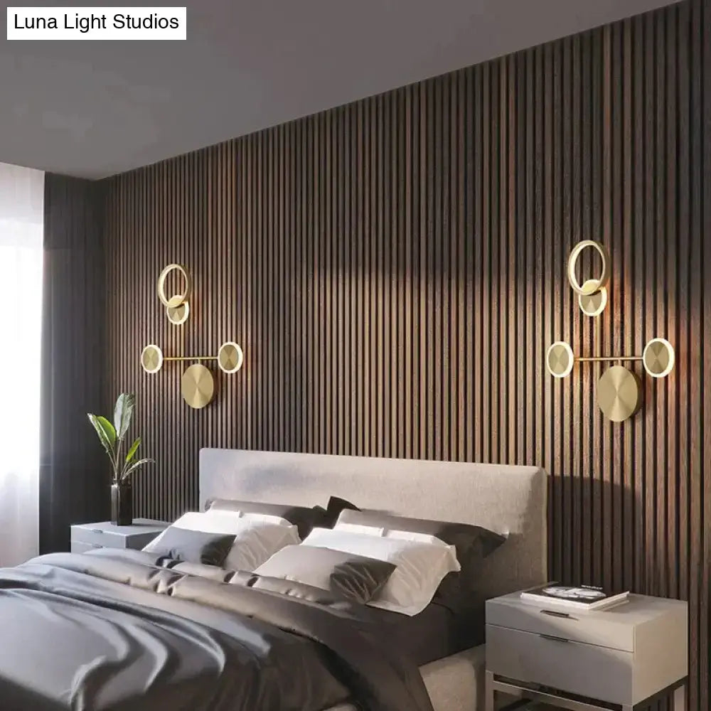 Modern golden geometric led wall lamp with gold-toned circular design for minimalist living room wall lamp decor