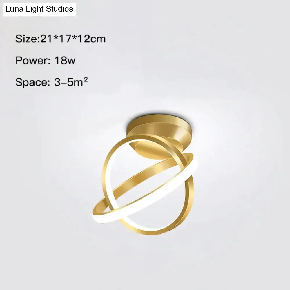 Modern golden geometric led wall lamp with intertwined circular rings in a sleek design for living room wall lamp