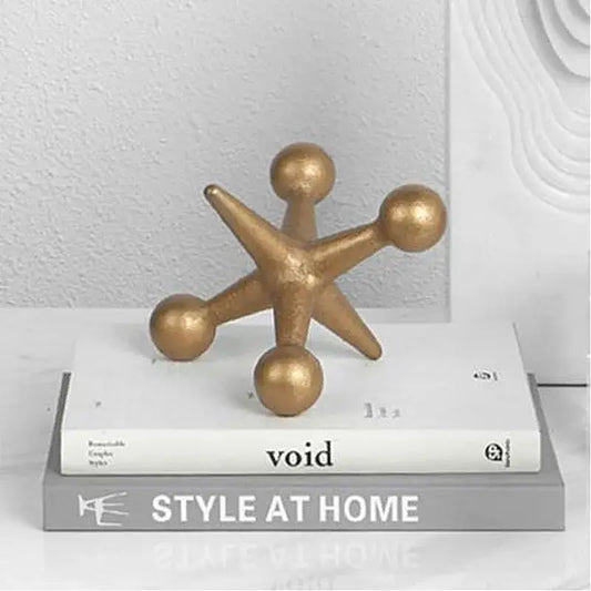 Modern golden geometric resin molecular model decor shaped like a gold-finished metallic star with rounded points and spheres