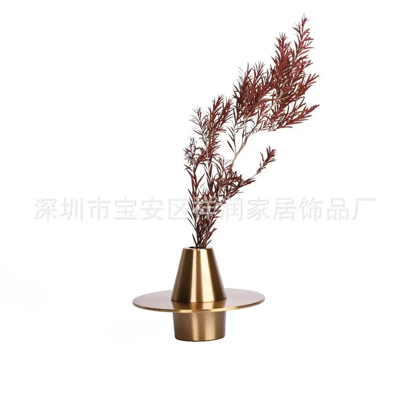 Brass-toned conical vase with circular base holding dried reddish-brown foliage modern golden geometry metal decorbites geometry metal handicraft