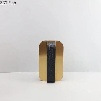 Modern golden geometry vase desk decor with a gold and black clutch featuring a textured crocodile embossed strap by decorbites golden geometry