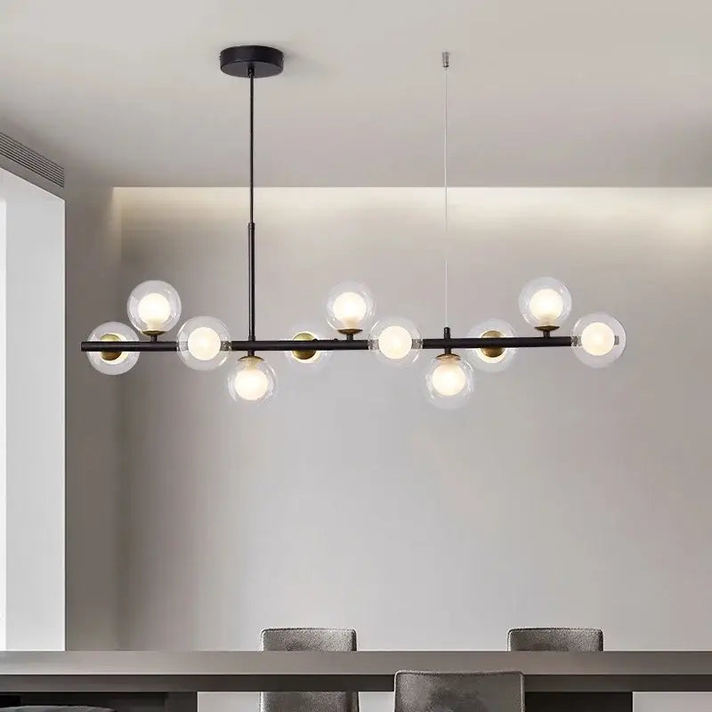 Modern black metal glass ball chandelier with clear globe bulbs and golden glass ball accents for dining room decorbites