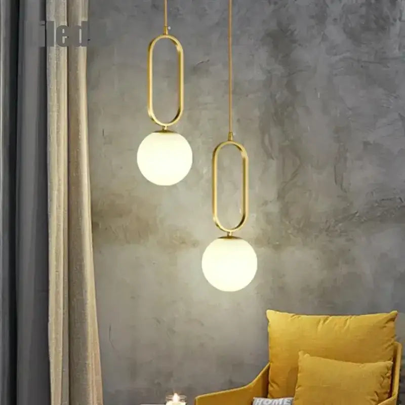 Modern golden glass ball pendant light with oval metal frame and frosted glass globe shades for kitchen decorbites golden glass