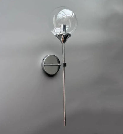 Chrome-finished wall lamp with clear glass globe shade from decorbites golden glass ball modern bedroom sconce
