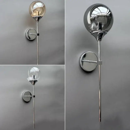 Modern golden glass ball wall sconce with chrome finish and clear glass globe from decorbites golden glass collection