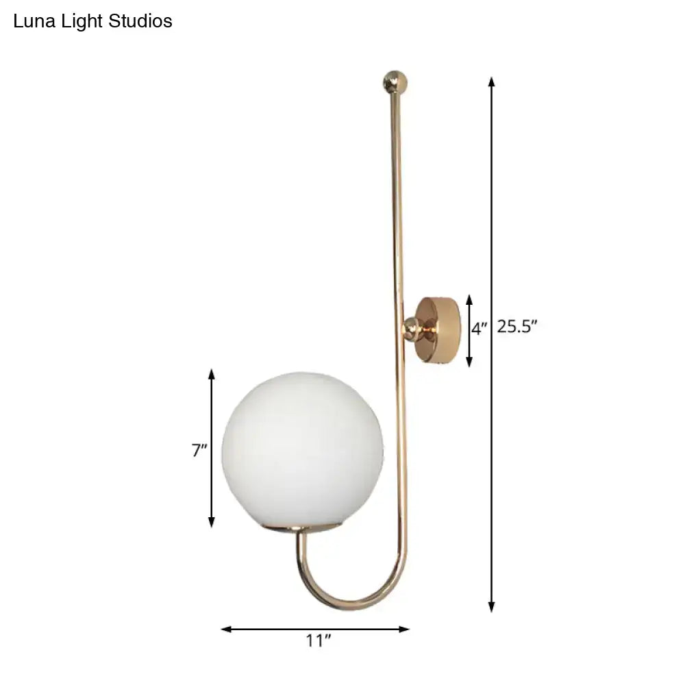 Modern golden gooseneck wall sconce with frosted glass ball shade and minimalist curved metal arm for bedroom use