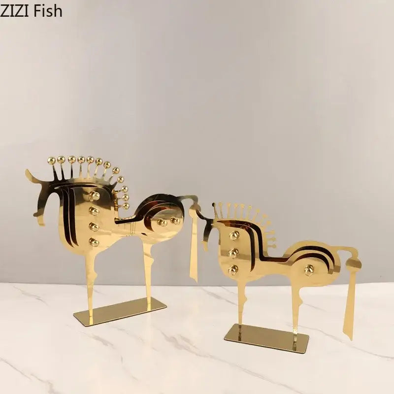 Modern golden horse metal sculpture with intricate cut-out designs and spherical accents decorbites golden horse decor